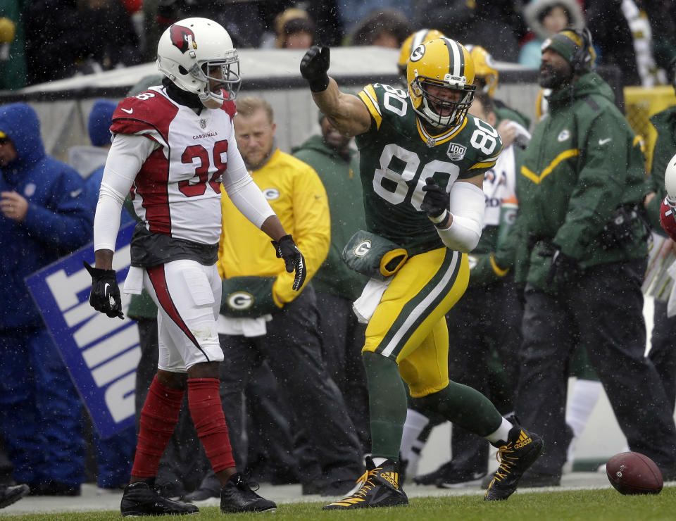 Green Bay Packers tight end Jimmy Graham (80) signals first down after making a catch while being covered by Arizona Cardinals defensive back David Amerson (38) during the first half of an NFL football game Sunday, Dec. 2, 2018, in Green Bay, Wis. (AP Photo/Jeffrey Phelps)