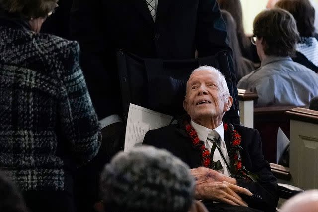 <p>ALEX BRANDON/POOL/AFP via Getty</p> Jimmy Carter attends Rosalynn's funeral service on Nov. 29, 2023, at the Plains church where he taught Sunday school