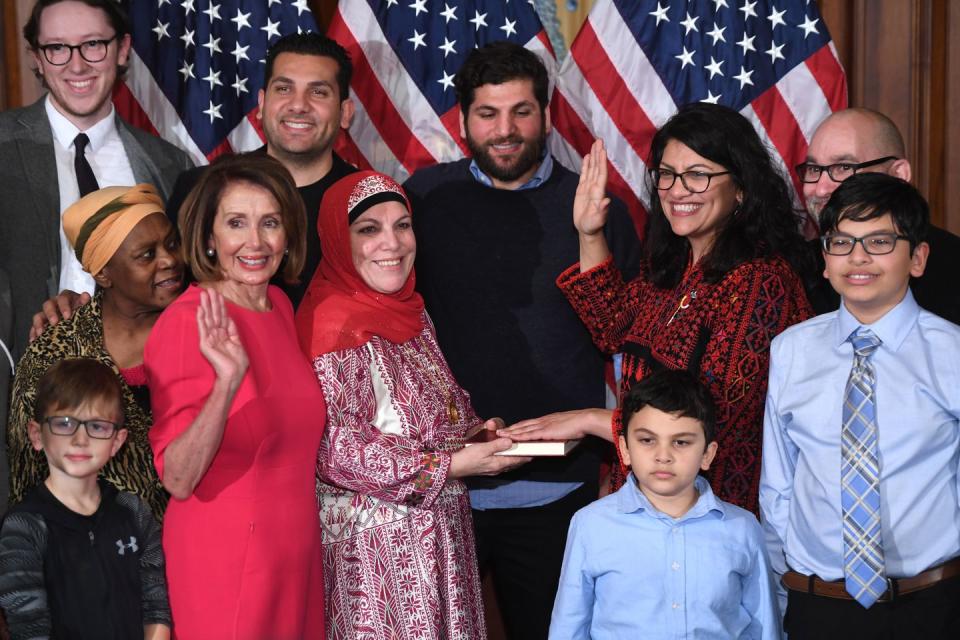 <p>Rep. Rashida Tlaib is officially sworn in while <a rel="nofollow noopener" href="https://www.elle.com/culture/career-politics/a25714487/rashida-tlaib-thobe-sworn-into-congress/" target="_blank" data-ylk="slk:wearing;elm:context_link;itc:0;sec:content-canvas" class="link ">wearing</a> a traditional Palestinian thobe.</p>