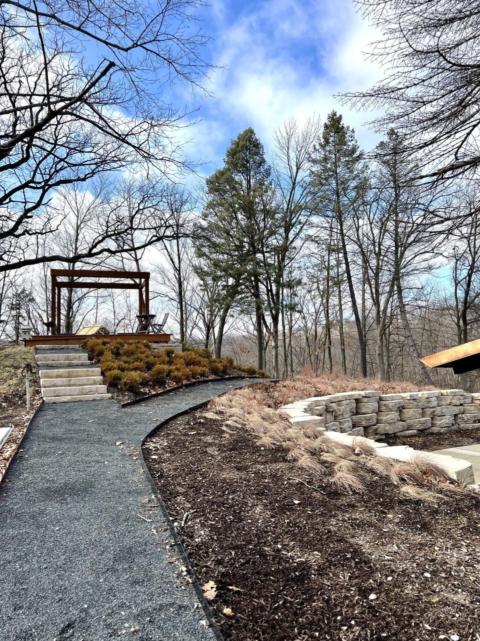 A gravel path leads to a pergola at the Blickenstaff home.