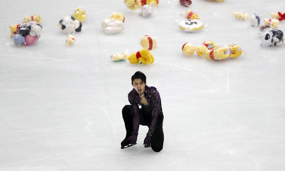 Japan's Yuzuru Hanyu celebrates after competing in the men's free skating during the figure skating Grand Prix finals at the Palavela ice arena, in Turin, Italy, Saturday, Dec. 7, 2019. (AP Photo/Antonio Calanni)