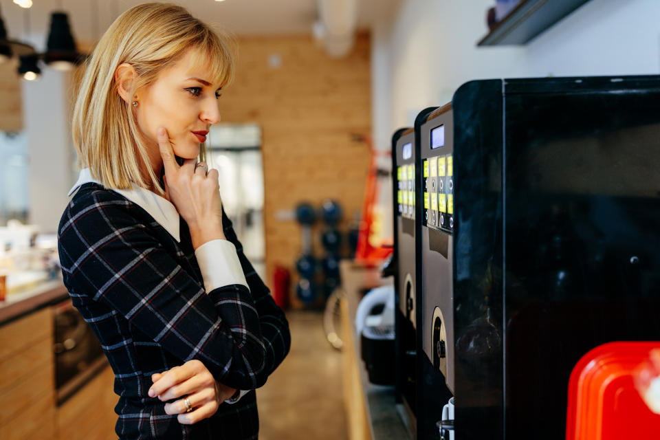 Woman trying not to drink coffee. (Getty Images)