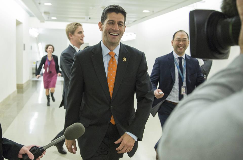 Rep. Paul Ryan (R-WI) (C) leaves a meeting about his bid to be the next Speaker of the House with moderate members of the House Republican caucus on Capitol Hill in Washington October 22, 2015. REUTERS/Joshua Roberts