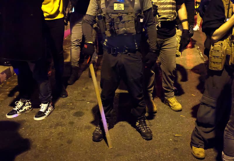 People take part in a rally to protest the results of the election, in Washington