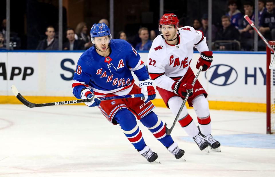 Jan 2, 2024; New York, New York, USA; New York Rangers left wing Artemi Panarin (10) and Carolina Hurricanes defenseman Brett Pesce (22) skate during the first period at Madison Square Garden. Mandatory Credit: Danny Wild-USA TODAY Sports