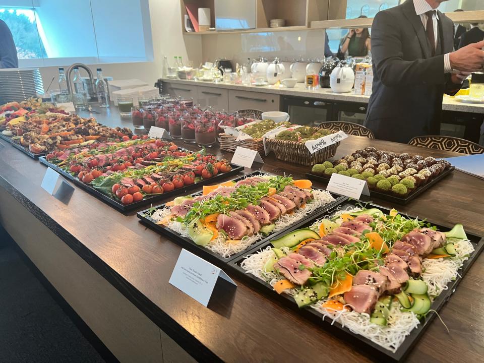 A sampling of foods in Farnborough Airport at a VistaJet event include chocolate mousse, tuna teriyaki, and beef filet salads.
