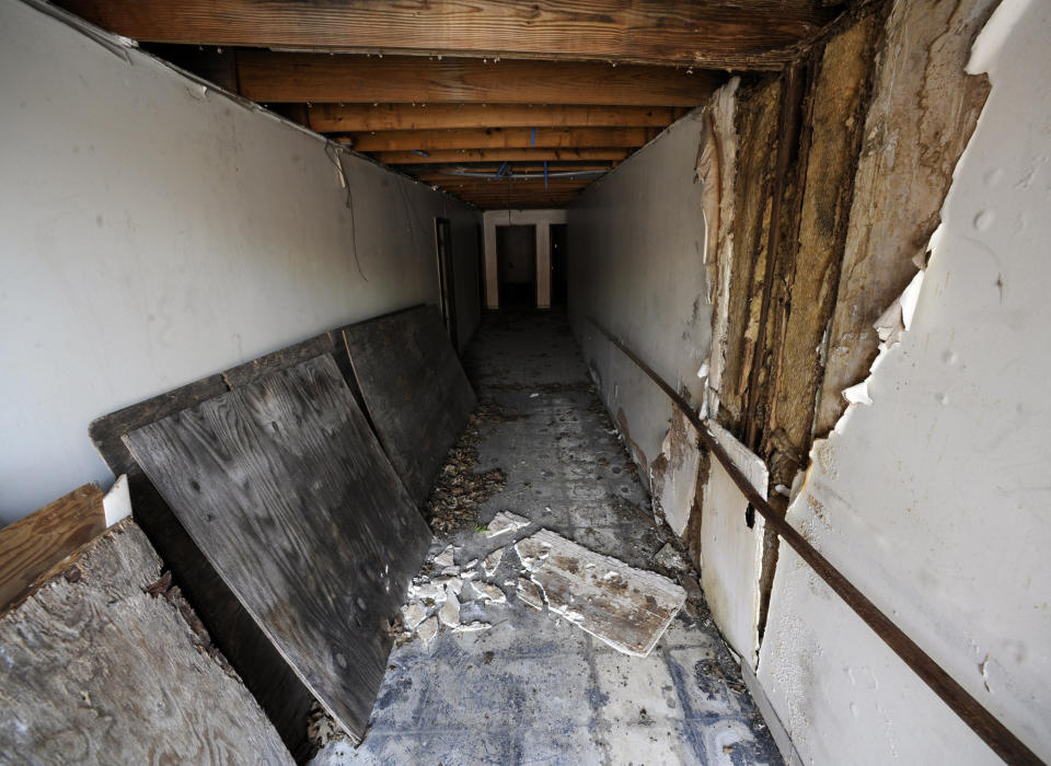 A littered hallway is shown in the historic A.G. Gaston Motel during renovation work in Birmingham, Ala., on Wednesday, April 17, 2019. Once featured in the "The Negro Motorist Green Book," the long-closed motel provided a home for Martin Luther King Jr. during civil rights demonstrations in the 1960s. It is is being transformed into the centerpiece of a new national civil rights monument. (AP Photo/Jay Reeves)