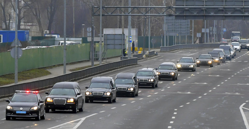 In this photo provided by the Ukrainian Presidential Press Office, a motorcade of hearses carry the bodies of the eleven Ukrainian victims of the Ukrainian 737-800 plane that crashed on the outskirts of Tehran, at Borispil international airport outside Kyiv, Ukraine, Sunday, Jan. 19, 2020. An Ukrainian passenger jet carrying 176 people has crashed just minutes after taking off from the Iranian capital's main airport on Jan. 8, 2020. (Ukrainian Presidential Press Office via AP)