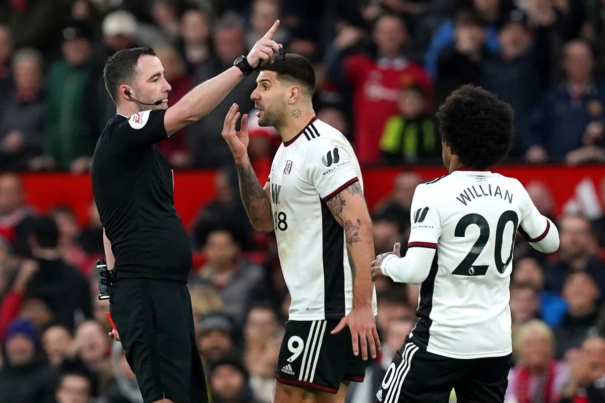 Aleksandar Mitrovic (centre) and referee Chris Kavanagh (Martin Rickett/PA) (PA Wire)