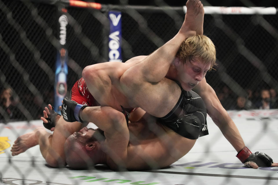 Paddy Pimblett, top, fights Jared Gordon during a UFC 282 mixed martial arts lightweight bout Saturday, Dec. 10, 2022, in Las Vegas. (AP Photo/John Locher)