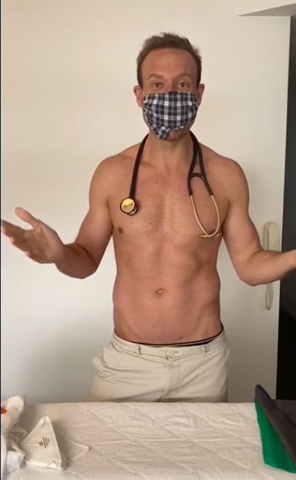 doctor wearing a face mask with his top off
