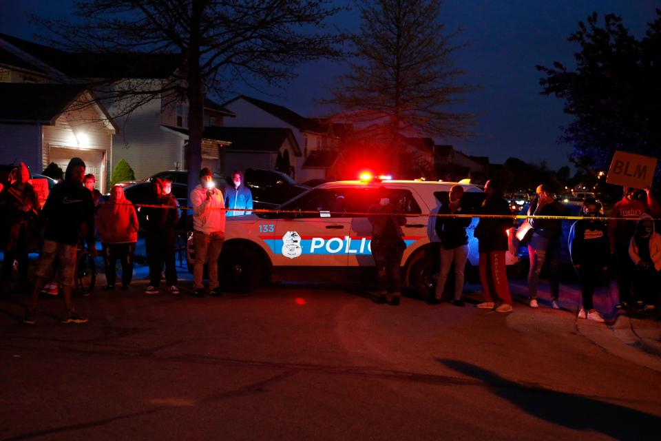 <p>A crowd gathers to protest in the neighbourhood where a Columbus police officer fatally shot a teenage girl on Tuesday</p> (AP)