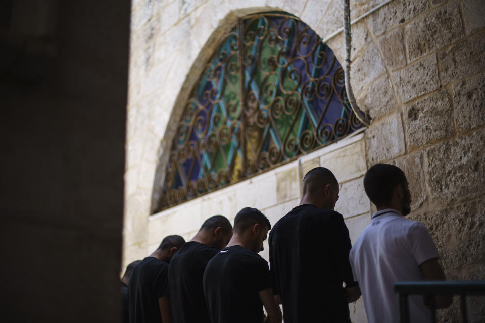 Muslims take part in Friday prayers at Al-Omari mosque in the mixed Arab-Jewish town of Lod, central Israel, Friday, May 28, 2021. Although Arabs make up 30% of Lod's population, only 14% of municipal employees are Arabs, with only four on the 19-member city council. The city hasn't had an Arab deputy mayor in four decades, the report said. (AP Photo/David Goldman)