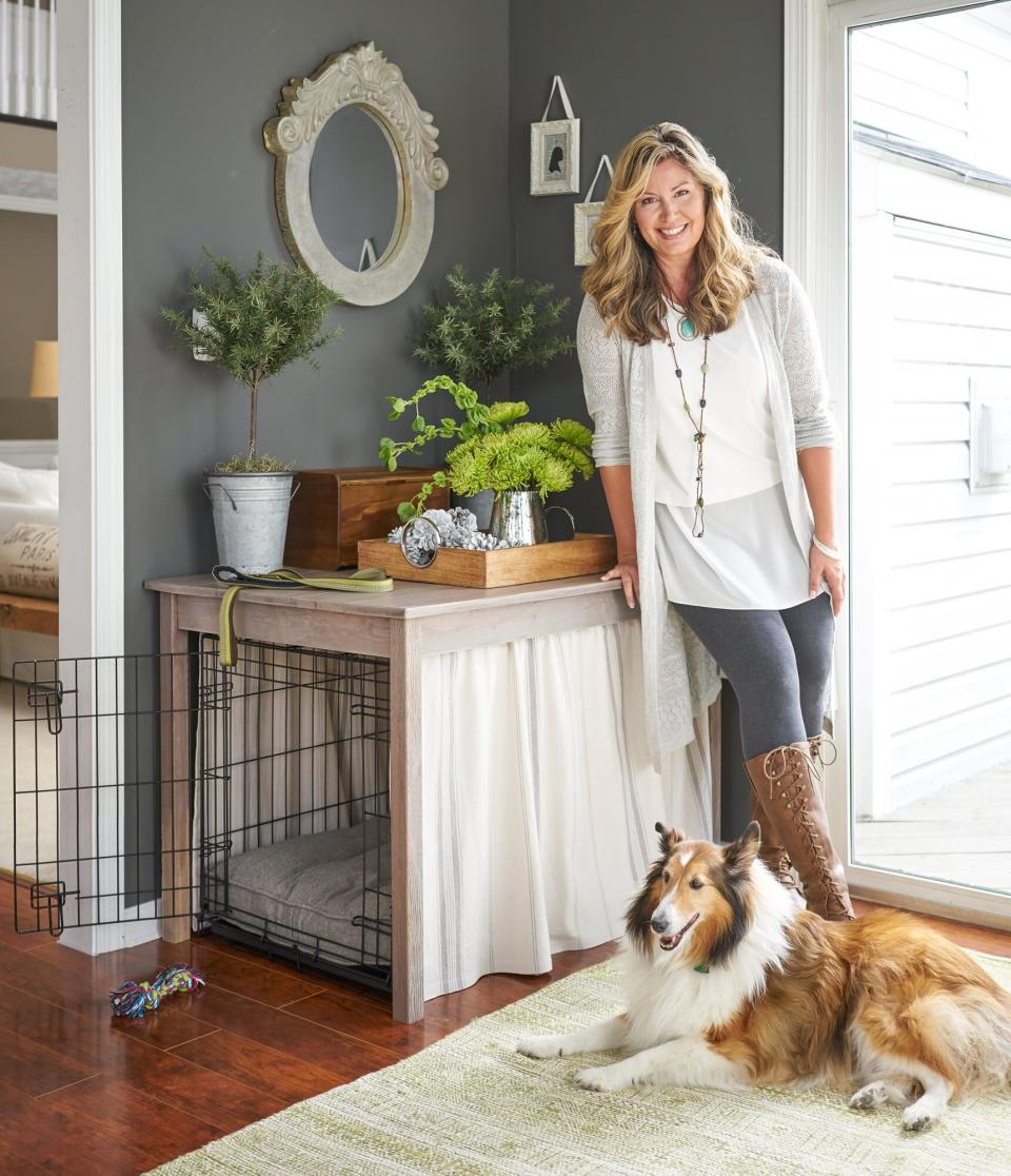 woman and her dog next to a dog kennel made into a table