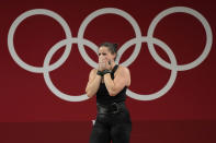 Maude G. Charron of Canada cries after the last lift in the women's 64kg weightlifting event, at the 2020 Summer Olympics, Tuesday, July 27, 2021, in Tokyo, Japan. (AP Photo/Luca Bruno)