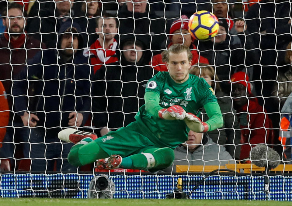 Loris Karius saved a penalty from Harry Kane that he had conceded himself on an eventful day for the Liverpool goalkeeper.