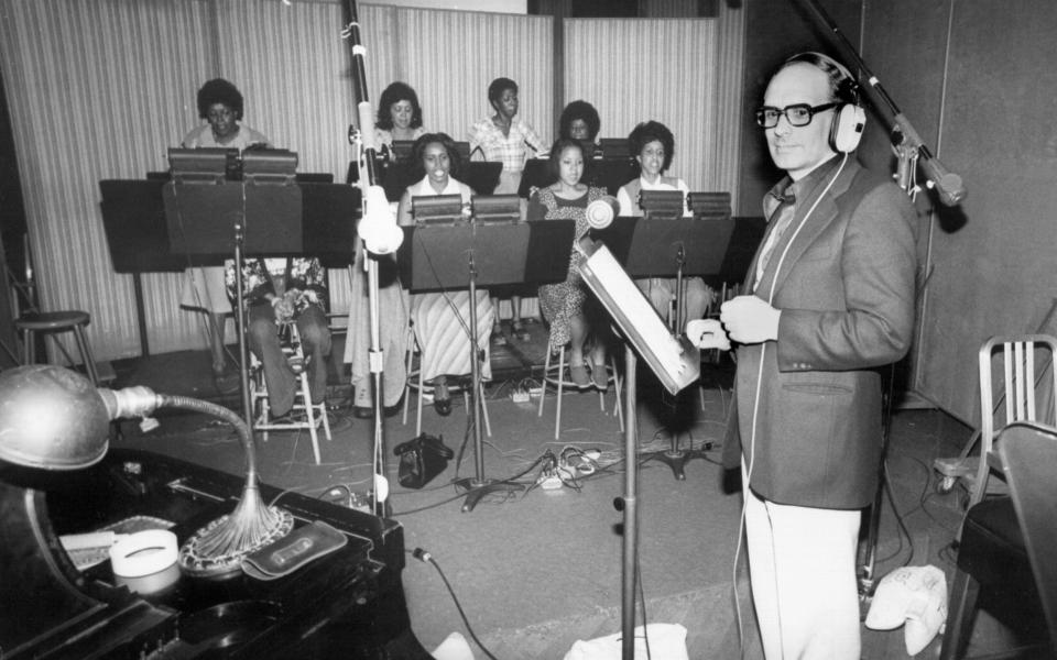 Morricone records a vocal group for the score of Exorcist II: The Heretic in 1977 - Michael Ochs Archives/Getty Images