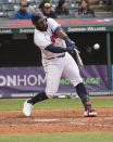 Cleveland Indians' Franmil Reyes hits an RBI single during the sixth inning of a baseball game in Cleveland, Monday, April 26, 2021. (AP Photo/Phil Long)