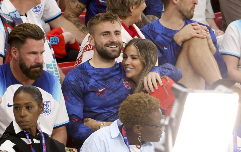 DOHA, QATAR - NOVEMBER 29: Luke Shaw of England and girlfriend Anouska Santos following the FIFA World Cup Qatar 2022 Group B match between Wales and England at Ahmad Bin Ali Stadium on November 29, 2022 in Doha, Qatar. (Photo by Jean Catuffe/Getty Images)