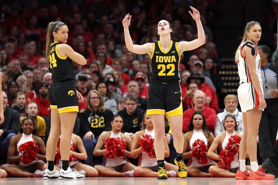 COLUMBUS, OHIO - JANUARY 21: Caitlin Clark #22 of the Iowa Hawkeyes reacts after being called for a foul during the third quarter of the game against the Ohio State Buckeyes at Value City Arena on January 21, 2024 in Columbus, Ohio. Ohio State defeated Iowa 100-92 in overtime. (Photo by Kirk Irwin/Getty Images)