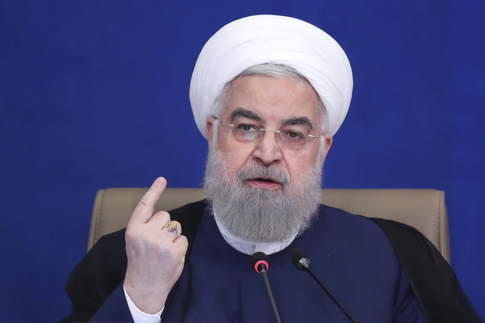 In this photo released by the official website of the office of the Iranian Presidency, President Hassan Rouhani speaks in a cabinet meeting in Tehran, Iran, Wednesday, July 14, 2021. The Iran's outgoing president on Wednesday warned his country could enrich uranium at weapons-grade levels of 90% if it chose, though it still wanted to save its tattered nuclear deal with world powers. (Iranian Presidency Office via AP)