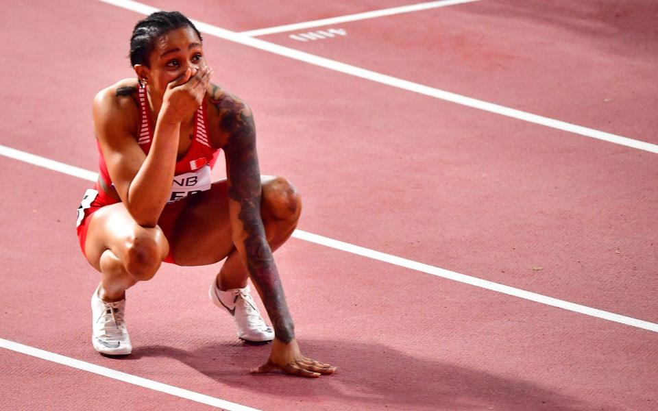 Bahrain's Salwa Eid Naser celebrates after winning the Women's 400m final at the 2019 IAAF Athletics World Championships at the Khalifa International stadium in Doha on October 3, 2019 - AFP/GIUSEPPE CACACE 