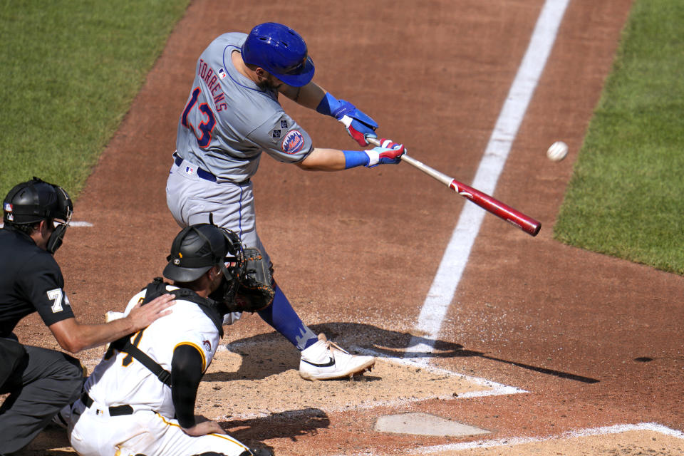 New York Mets' Luis Torrens (13) hits a double off Pittsburgh Pirates relief pitcher Dennis Santana, driving in three runs, during the third inning of a baseball game in Pittsburgh, Saturday, July 6, 2024. (AP Photo/Gene J. Puskar)