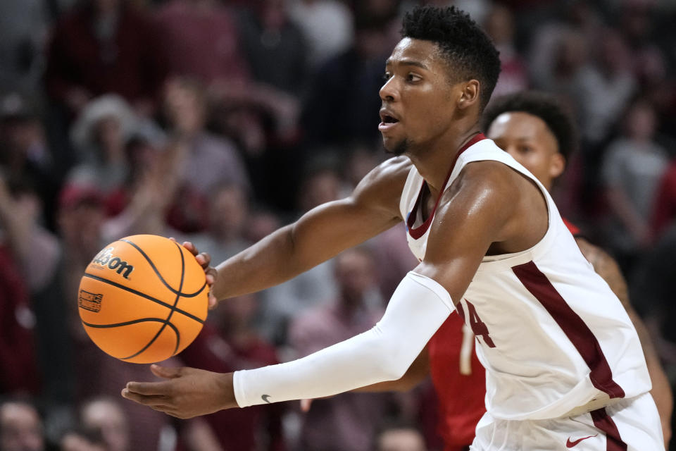 Alabama forward Brandon Miller passes the ball during the second half of the team's second-round college basketball game against Maryland in the men's NCAA Tournament in Birmingham, Ala., Saturday, March 18, 2023. Alabama won 73-51. (AP Photo/Rogelio V. Solis)