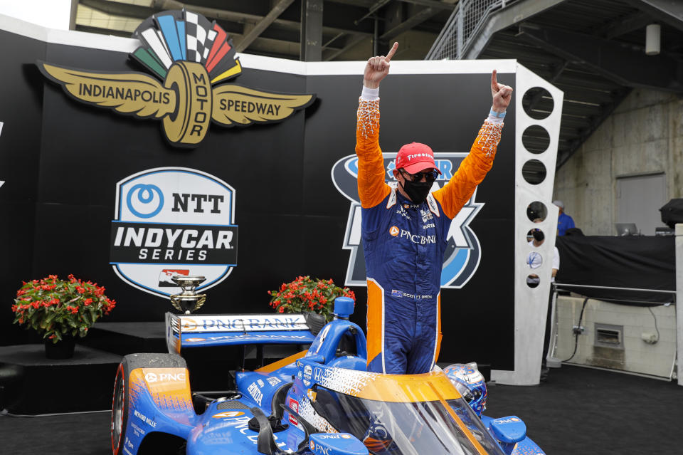 Race driver Scott Dixon, of New Zealand, celebrates after winning the IndyCar auto race at Indianapolis Motor Speedway in Indianapolis, Saturday, July 4, 2020. (AP Photo/Darron Cummings)