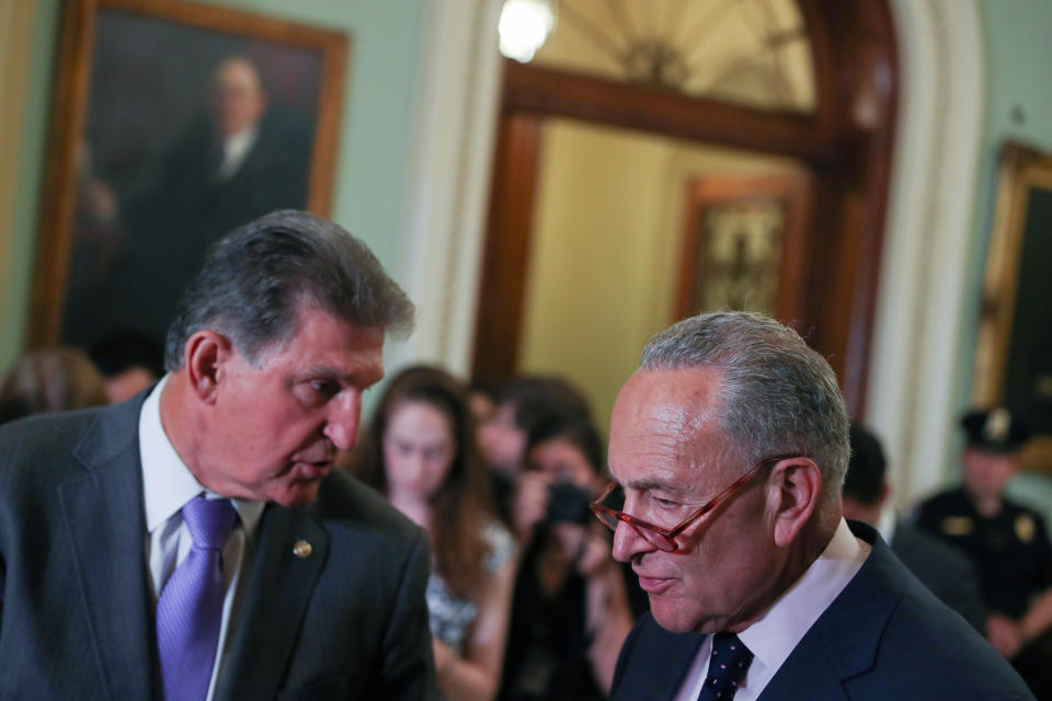 U.S. Senate Minority Leader Chuck Schumer (D-NY) and Senator Joe Manchin (D-WV) confer before addressing reporters following the weekly senate party caucus luncheons at the U.S. Capitol in Washington, U.S. July 9, 2019. REUTERS/Jonathan Ernst