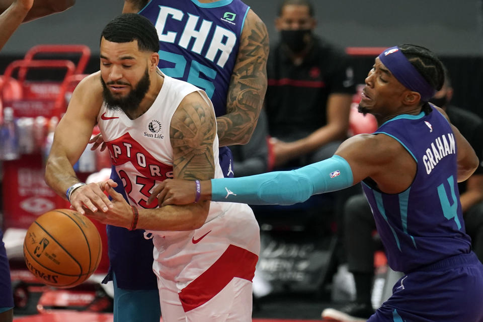 Toronto Raptors guard Fred VanVleet (23) gets fouled by Charlotte Hornets guard Devonte' Graham (4) during the first half of an NBA basketball game Thursday, Jan. 14, 2021, in Tampa, Fla. (AP Photo/Chris O'Meara)