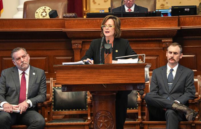 Rep. Andrew Murr, chairman of the House General Investigation Committee, right, and Rep. David Spiller, committee member, left, listen to committee deputy chair Ann Johnson, center, as she reads the evidence in favor of the impeachment of Attorney General Ken Paxton in the House.  Chamber at the Texas Capitol on Saturday, May 27, 2023.