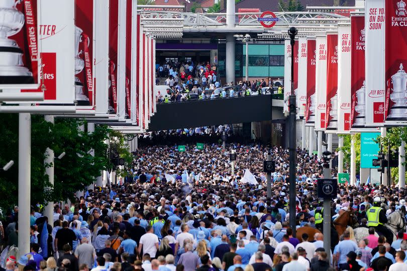 Fans walk down Wembley Way after last season's FA Cup Final between City and United -Credit:PA