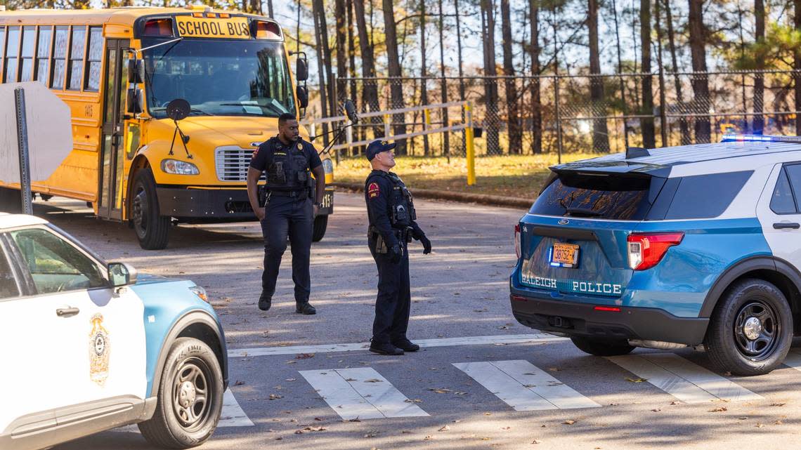 Police block an entrance at Southeast Raleigh High School during a Code Red lockdown Monday, Nov. 27, 2023. The school is on lockdown after a person was stabbed on campus.