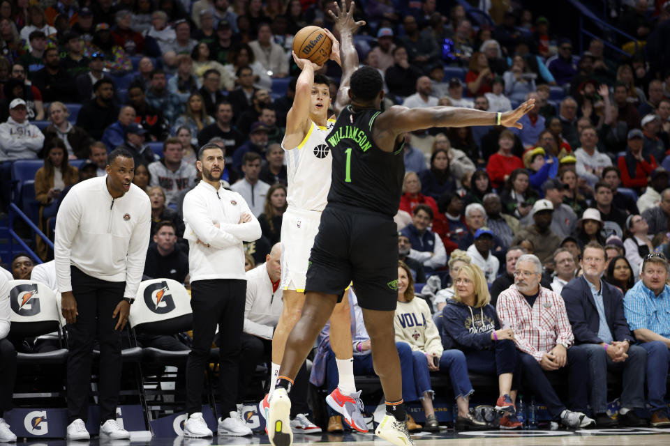 Utah Jazz forward Simone Fontecchio (16) shoots over New Orleans Pelicans forward Zion Williamson (1) in the first half of an NBA basketball game in New Orleans, Tuesday, Jan. 23, 2024. (AP Photo/Tyler Kaufman)