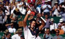 Novak Djokovic of Serbia reacts after defeating Pablo Carreno-Busta of Spain during the Monte Carlo Masters in Monaco April 17, 2014. REUTERS/Eric Gaillard