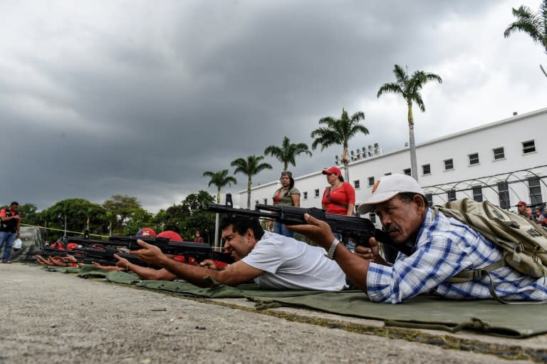 Venezuela's army teaches civilians how to shoot during military drills in Caracas