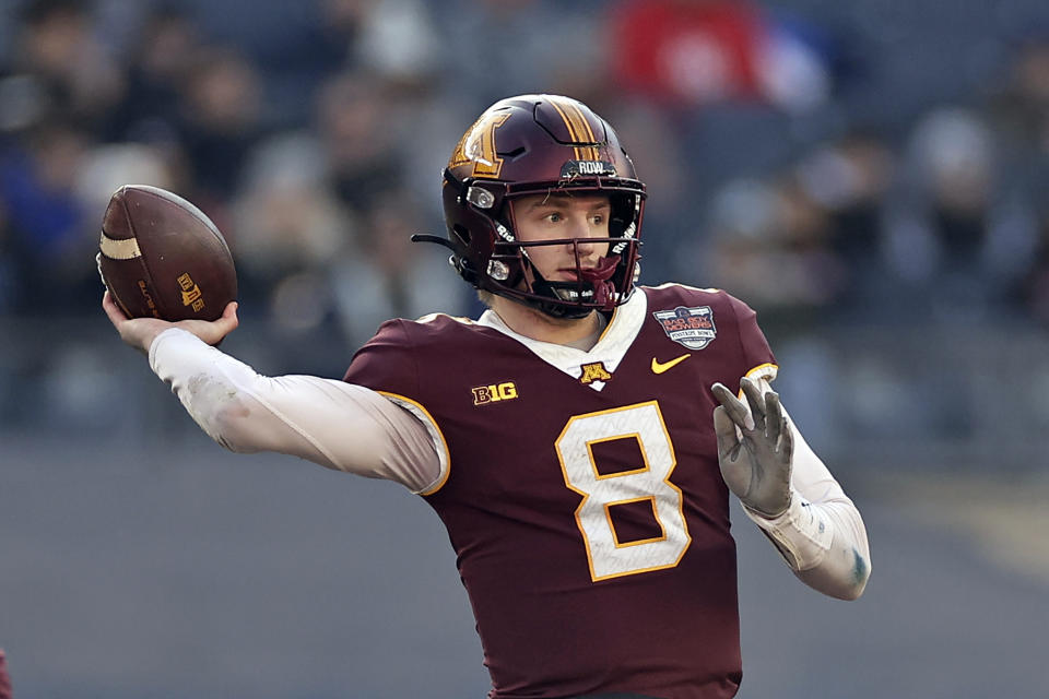 FILE - Minnesota quarterback Athan Kaliakmanis (8) throws against Syracuse during the first half of the Pinstripe Bowl NCAA college football game Thursday, Dec. 29, 2022, in New York. Minnesota opens their season at home against Nebraska on Aug. 31. (AP Photo/Adam Hunger, File)