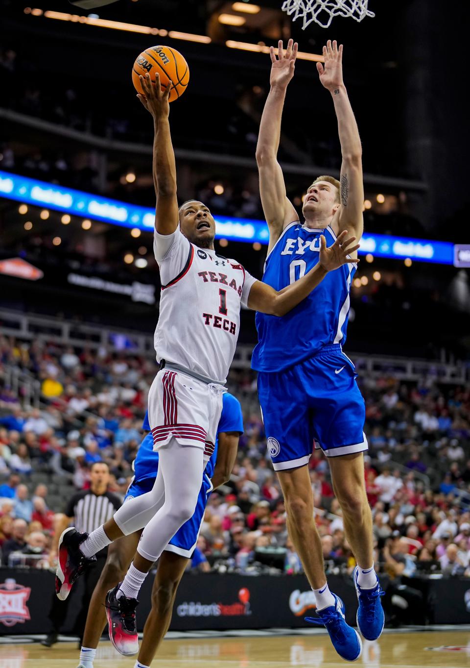 Lamar Washington #1 of Texas Tech shoots against Noah Waterman #0 of BYU during the first half of a quarterfinal game of the Big 12 Men's Basketball Tournament at T-Mobile Center on Thursday, March 14, 2024 in Kansas City, Missouri.