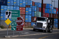 Cargo containers sit stacked at the Port of Los Angeles, Wednesday Oct. 20, 2021 in San Pedro, Calif. California Gov. Gavin Newsom on Wednesday issued an order that aims to ease bottlenecks at the ports of Los Angeles and Long Beach that have spilled over into neighborhoods where cargo trucks are clogging residential streets. (AP Photo/Ringo H.W. Chiu)