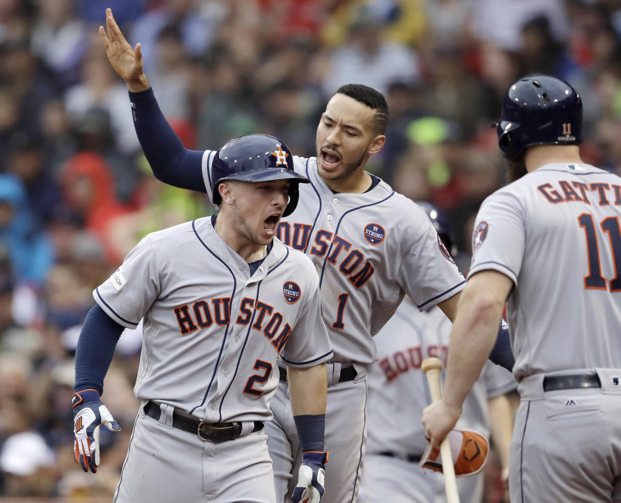 Houston Astros third baseman Alex Bregman (2) celebrates his home run with Carlos Correa, rear, and Evan Gattis, right during the eighth inning of Game 4 in baseball’s American League Division Series against the Boston Red Sox, Monday, Oct. 9, 2017, in Boston. (AP)