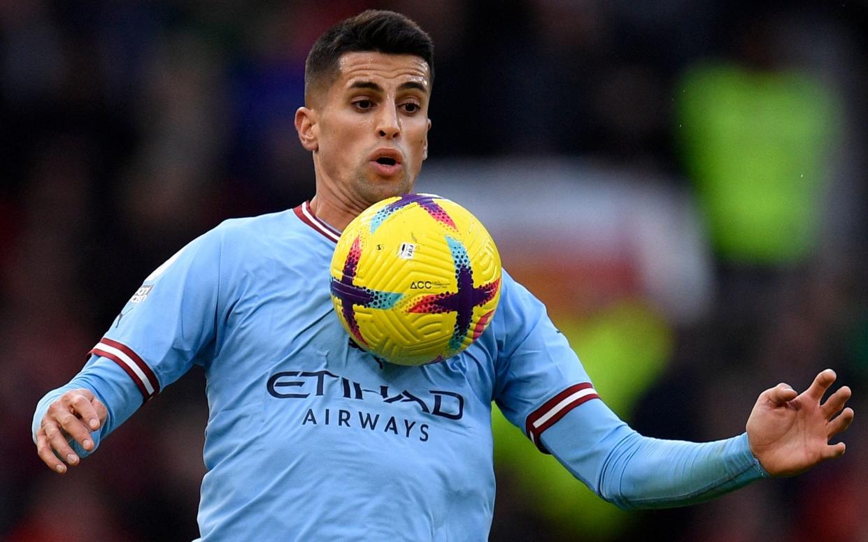 Joao Cancelo controlling a ball with his chest - Joao Cancelo loan to Bayern Munich shows Manchester City's faith in Rico Lewis - OLI SCARFF/GETTY