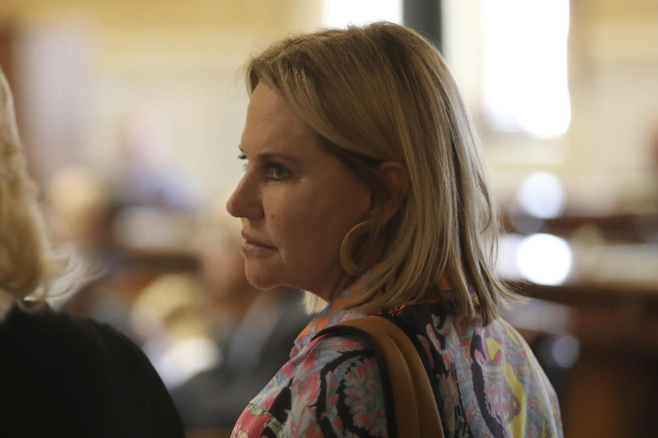 Republican South Carolina Sen. Sandy Senn, right, talks to a Republican colleague Sen. Penry Gustafson, left,, during debate over a bill banning abortion on Wednesday, Sept. 7, 2022, in Columbia, S.C. (AP Photo/Jeffrey Collins)