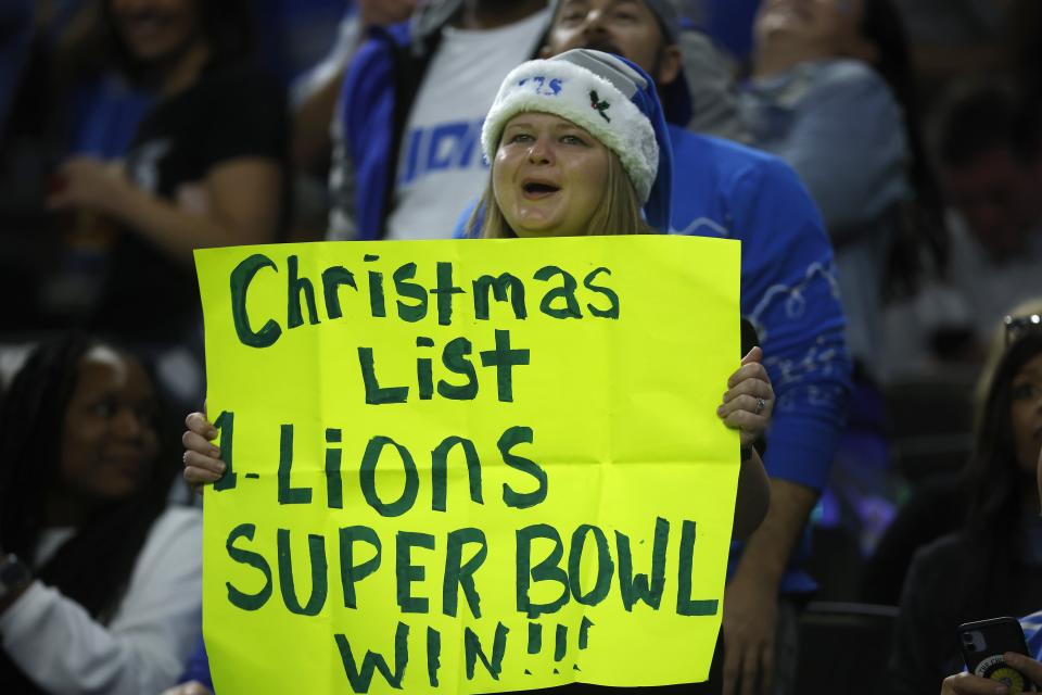 A Detroit Lions fan holds a sign during the first half vs. the New Orleans Saints, Sunday, Dec. 3, 2023, in New Orleans.