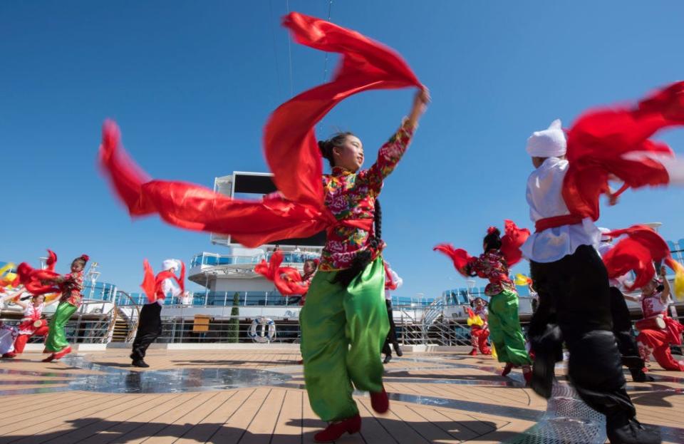 The Luochuan Yangko dance troupe from Yan'an city, Shaanxi province, China aboard Princess Cruises' newest ship "Majestic Princess" sailing out of the Port of Civitavecchia on May 21, 2017 in Rome, Italy. Beginning a 49 day trip from Rome to Shanghai, China, the 143,000 tonne ship carrying 3560 guests will be the largest Princess ship ever to be deployed in Chinese waters. 