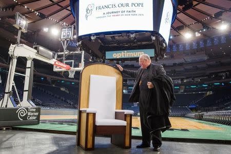 Archbishop of New York Timothy Michael Dolan speaks about a chair that will be used in Madison Square Garden for Pope Francis’ upcoming Papal Mass in New York September 2, 2015. REUTERS/Lucas Jackson