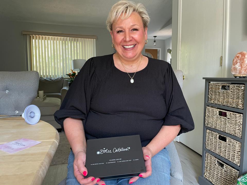 Beth Williams holds one of her Dolce Catalina eyelash kits at her Brighton home on Wednesday, May 15.