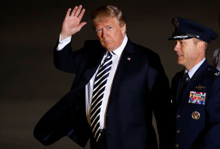 President Donald Trump waves as he arrives to greet the three Americans formerly held hostage in North Korea, at Joint Base Andrews, Maryland, U.S., May 10, 2018. REUTERS/Jim Bourg