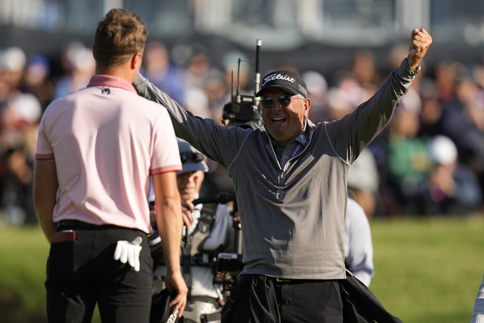 Justin Thomas is greeted by is dad Mike after winning the PGA Championship golf tournament in a playoff against Will Zalatoris at Southern Hills Country Club, Sunday, May 22, 2022, in Tulsa, Okla. (AP Photo/Eric Gay)