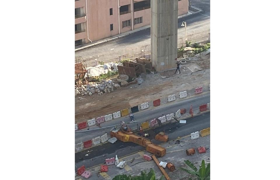 A view of the toppled crane at the scene at a construction site along the Sungai Besi-Ulu Kelang Elevated Expressway in Cheras March 22, 2021. — Picture via Twitter